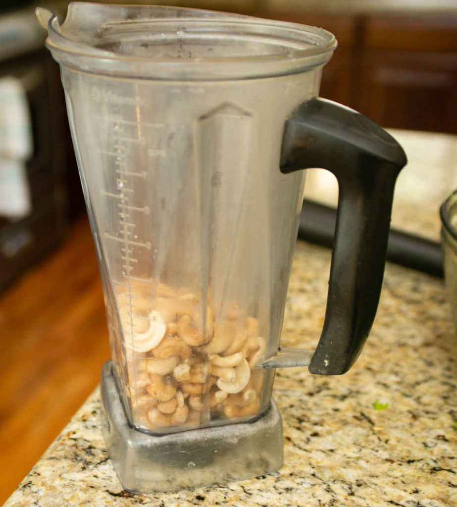 Put cashews in blender